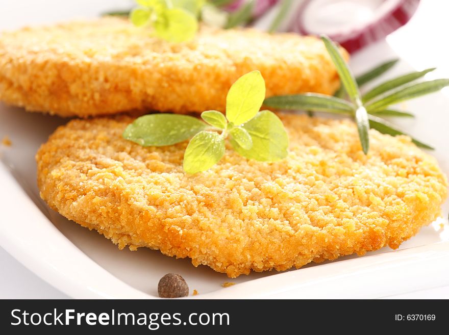 Fried chicken with herbs and onion. Fried chicken with herbs and onion