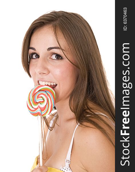 Girl licking her lollipop isolated on white. Girl licking her lollipop isolated on white