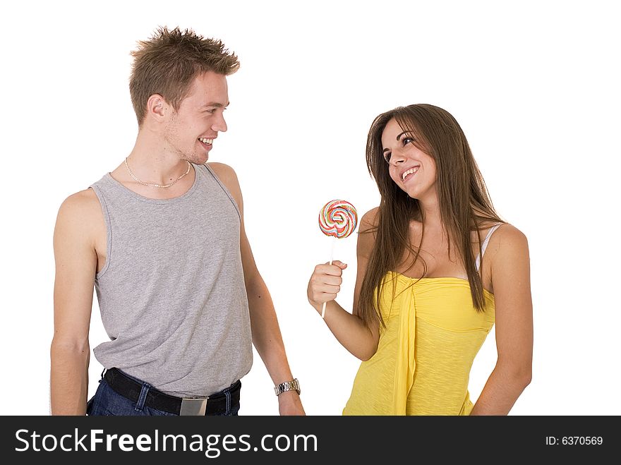 Guy giving his girlfriend a lollipop. Guy giving his girlfriend a lollipop