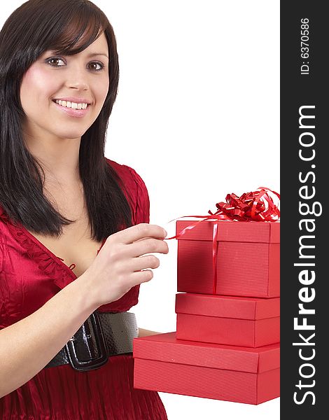 Portrait of a beautiful young brunette woman holding red gift boxes at a celebration. Portrait of a beautiful young brunette woman holding red gift boxes at a celebration