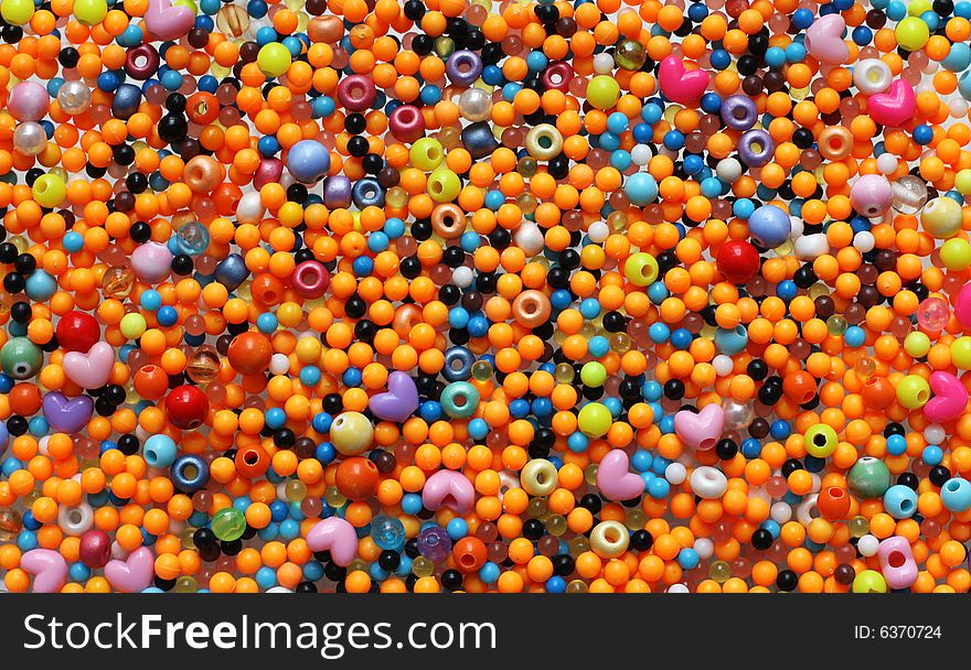 Multicolored small plastic beads background
