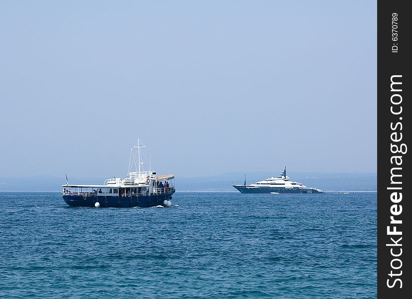 Photo of two ships in the blue Mediterranean sea