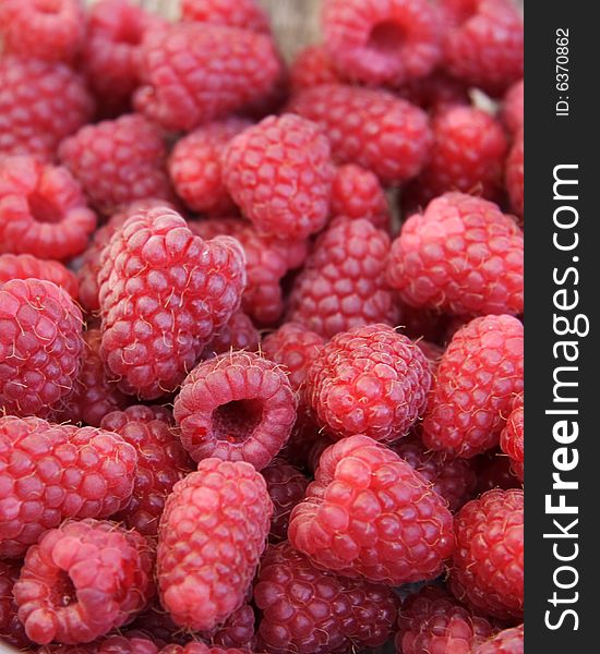 Closeup detail of fresh raspberries freshly picked