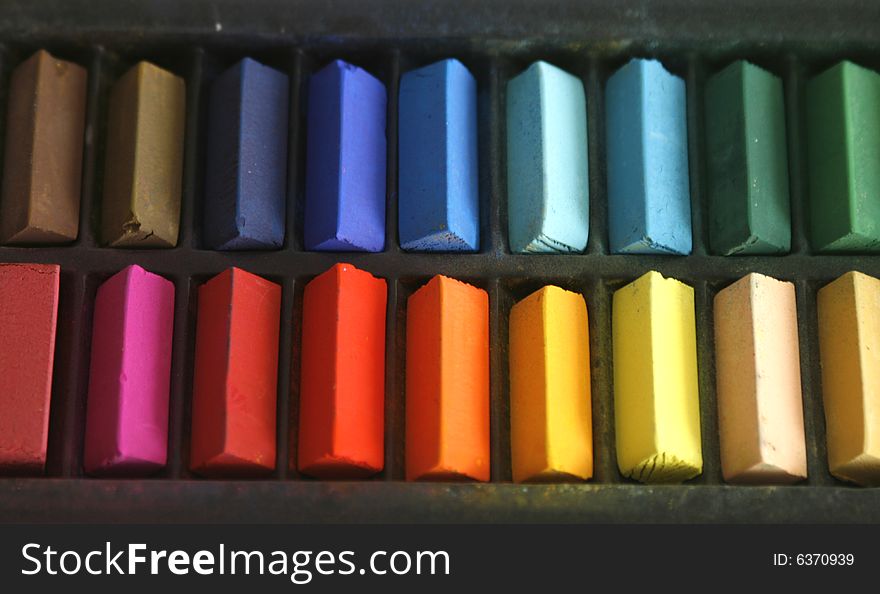 Close up of coloured pastels in a box. Close up of coloured pastels in a box