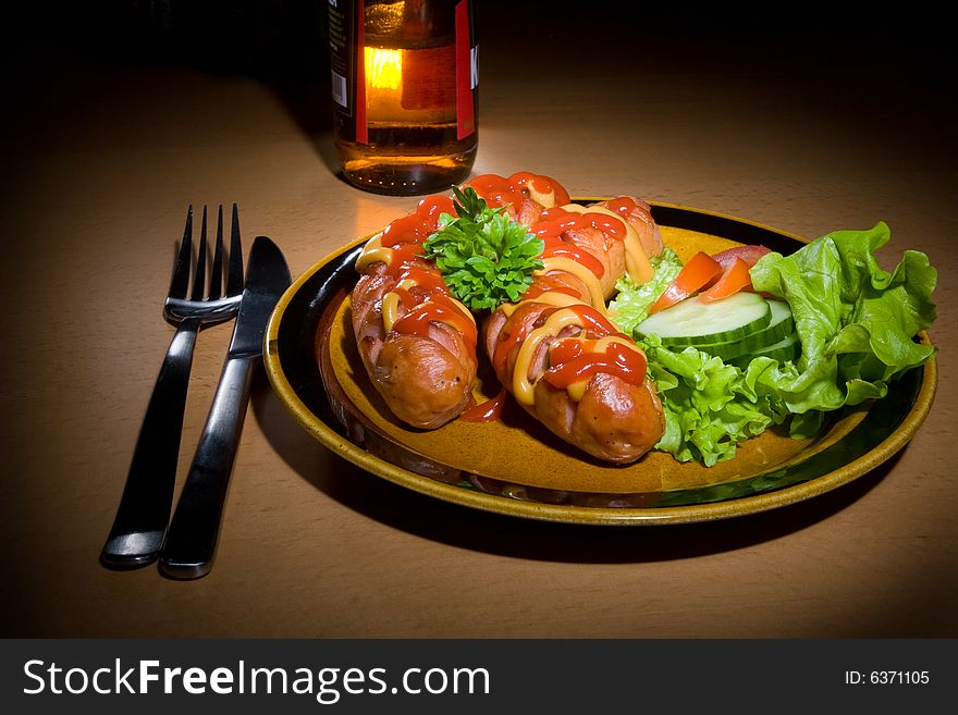 Sausages on plate with beer. Sausages on plate with beer