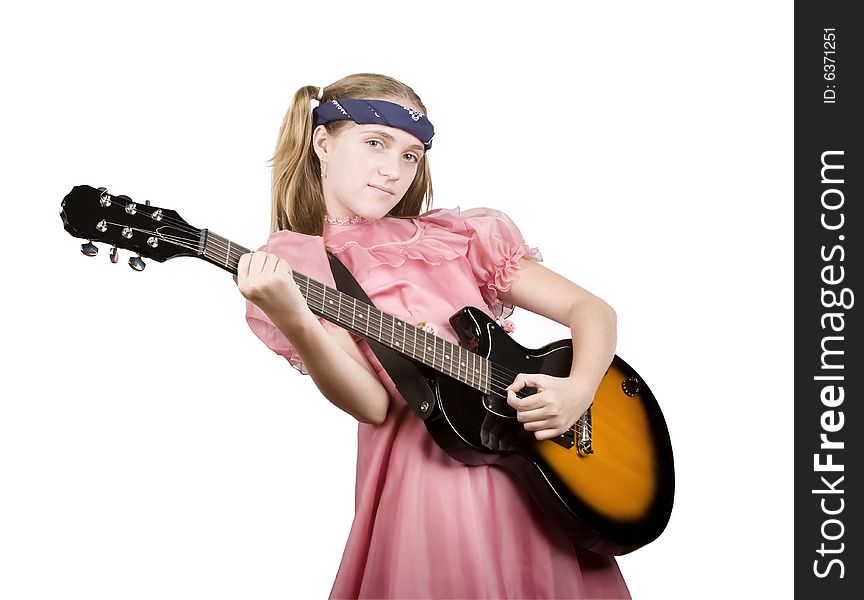 Young girl in a pink dress with an electric rock guitar. Young girl in a pink dress with an electric rock guitar