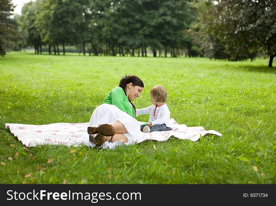 Happy family on green meadow. Happy family on green meadow