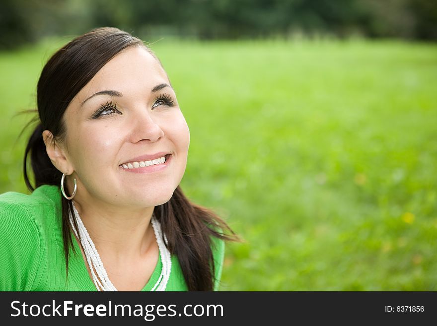 Attractive brunette woman in park. Attractive brunette woman in park