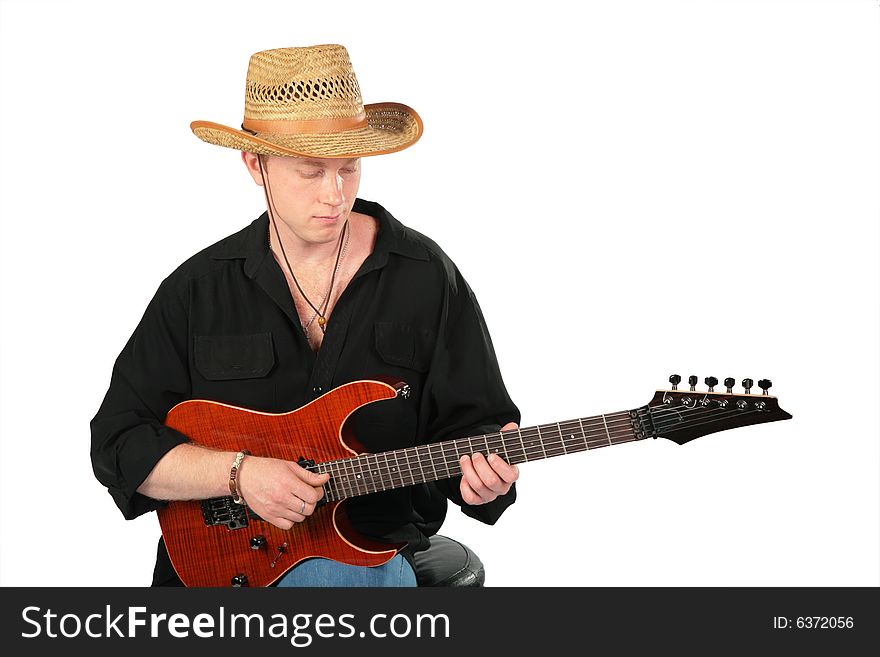 Young man in hat play on guitar