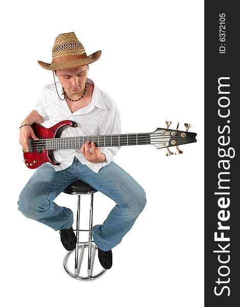 Young guitarist in hat. Full body. On white
