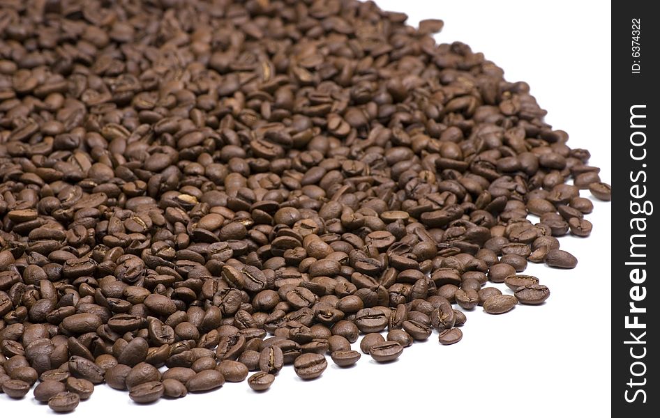 A pile of coffee beans on a white background. A pile of coffee beans on a white background