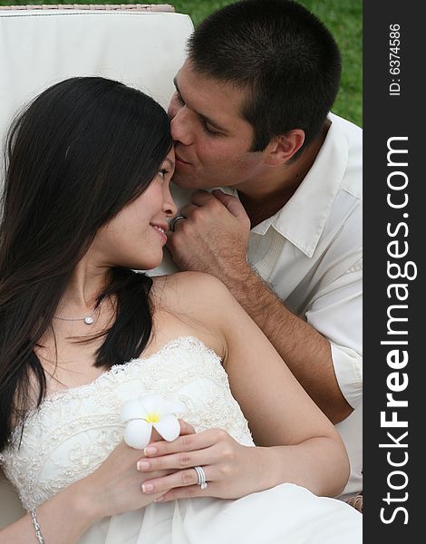 Groom kissing his bride