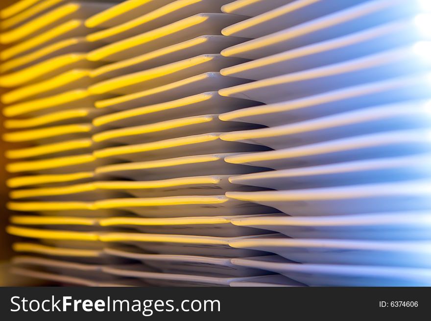 An abstract image of multiple stacks of plates. An abstract image of multiple stacks of plates