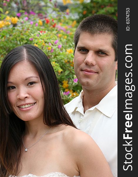 Attractive bride and groom on their wedding day. Attractive bride and groom on their wedding day.