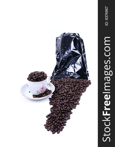 Coffee beans spilled from bag on white background. Coffee beans spilled from bag on white background