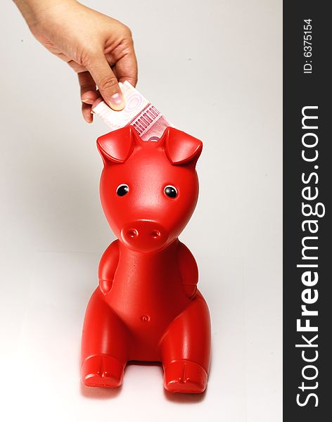 Child save the money in pig money box
