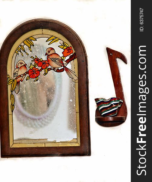 Still of wall decor of etched picture mirror and music note as decorative with white background replacement