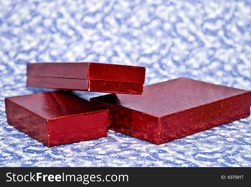 Red gifts on a winter backgrounds.