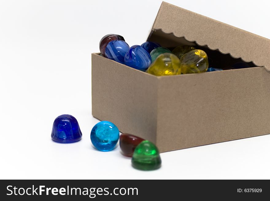 Gift box with colorful glass jewels shaped like gumdrops.