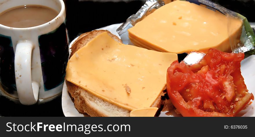 Still life of cheese and tomatoe for sandwich with beverage of hot coffee done with reflected and fill light. Still life of cheese and tomatoe for sandwich with beverage of hot coffee done with reflected and fill light
