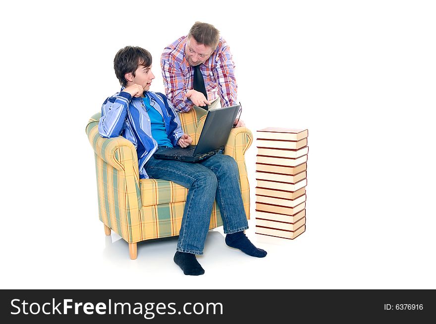 Teenager schoolboy with laptop books on white background