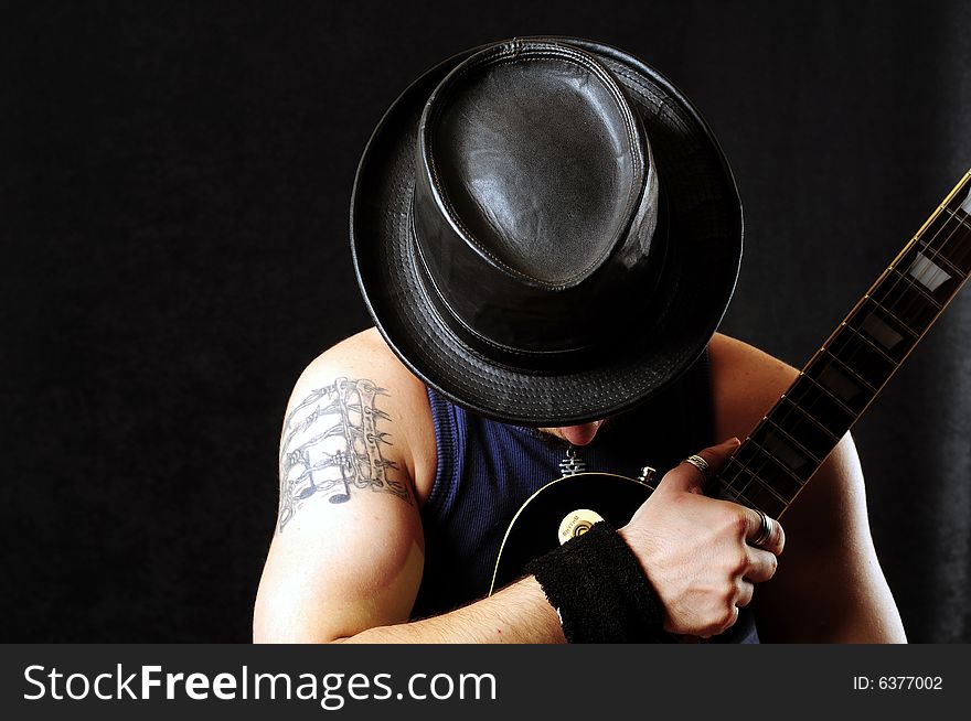 A view with a guitarist over black background