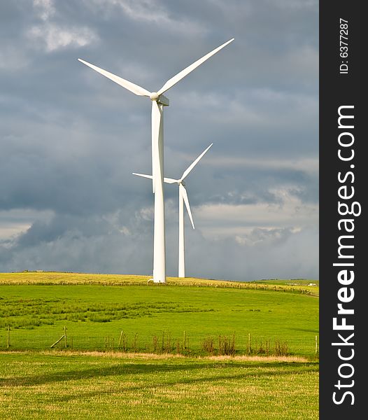 Beautiful green meadow with Wind turbines generating electricity. Beautiful green meadow with Wind turbines generating electricity
