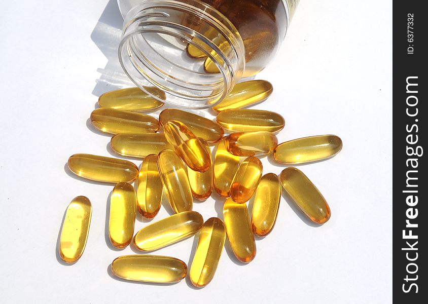 The yellow medicine capsules.