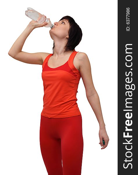 Woman in sports outfit drinking water isolated on white background