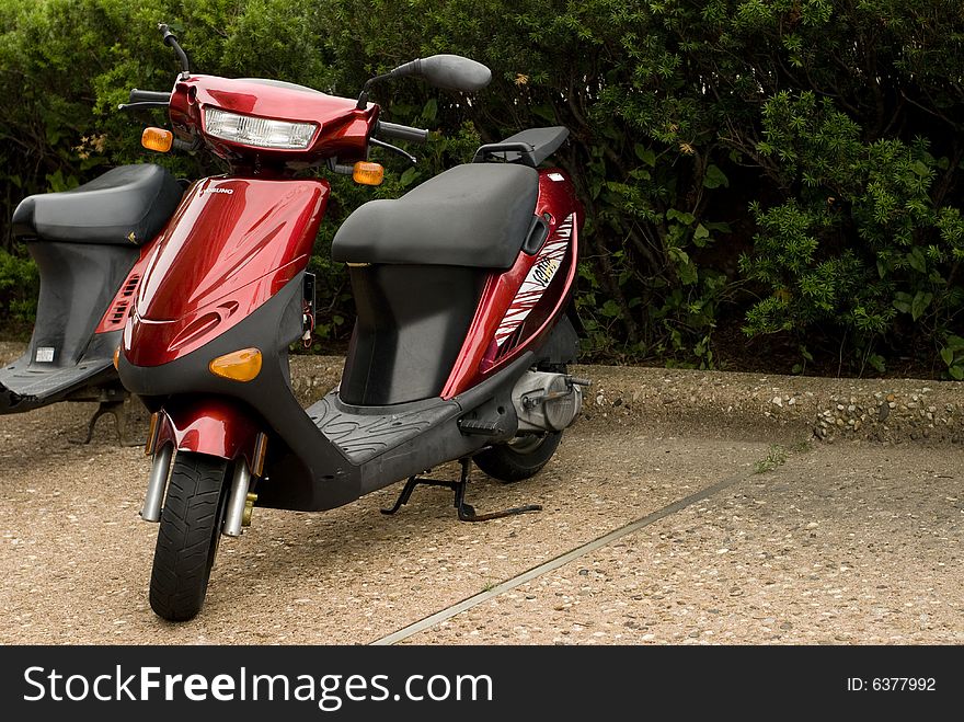 Cute photo of a red Vespa scooter. Cute photo of a red Vespa scooter