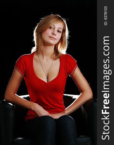 Pretty blonde woman on dark background