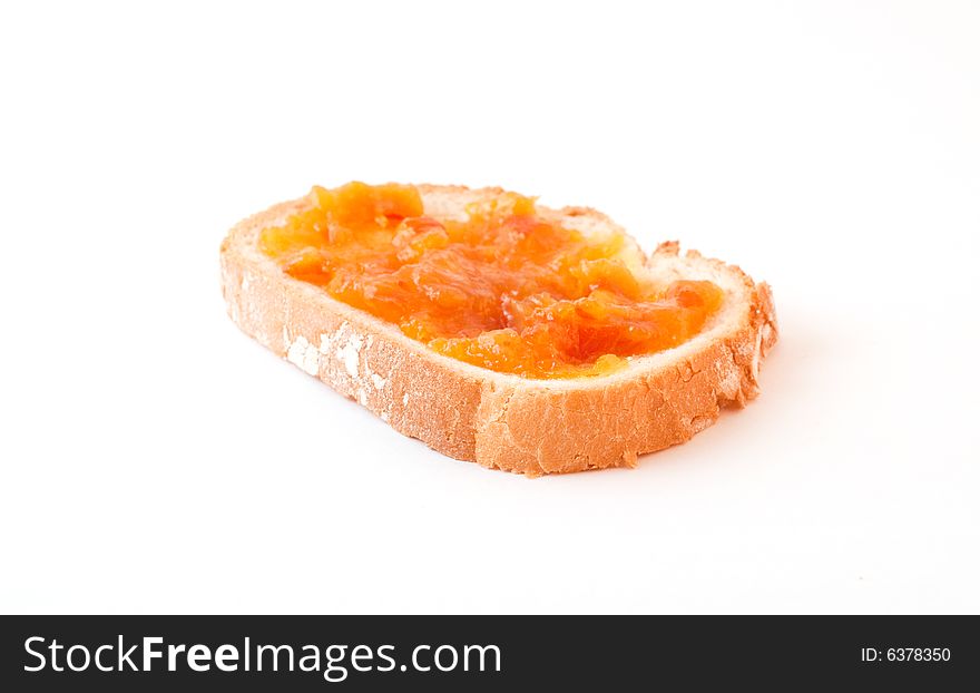 Marmalade spread on bread slice. Marmalade spread on bread slice