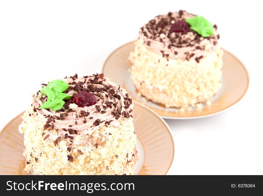 Two cakes isolated on a white background