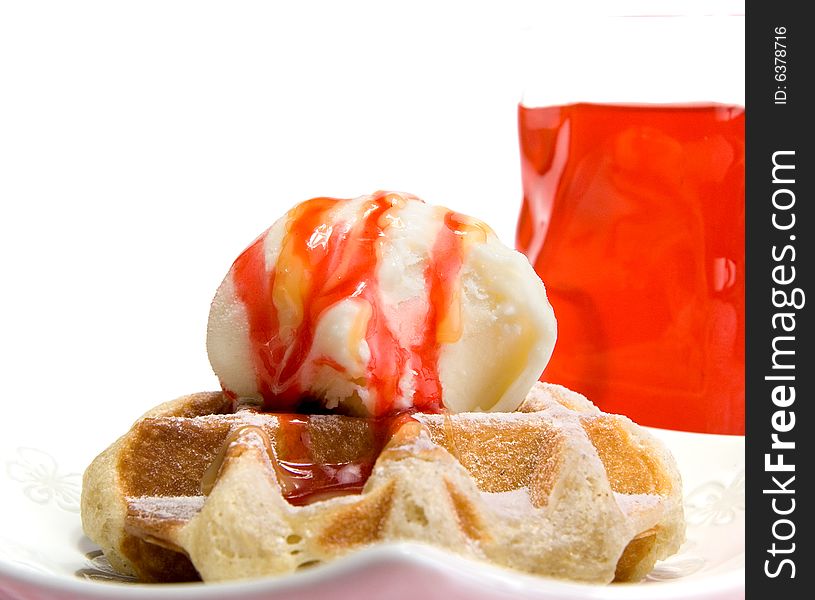 Waffle with vanilla ice cream and strawberry coating