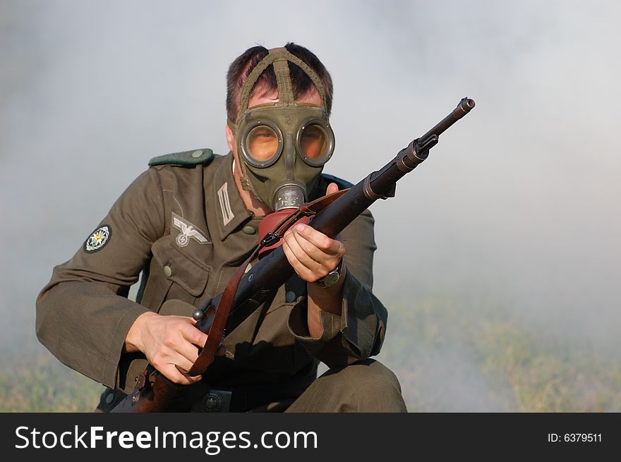 German Soldier In Gas Mask . WW2 Reenacting