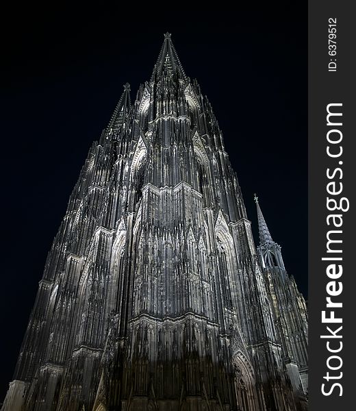 The night cathedral at Cologne, Germany against dark sky. The night cathedral at Cologne, Germany against dark sky.