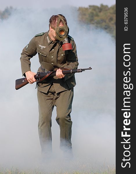 German Soldier In Gas Mask . WW2 Reenacting