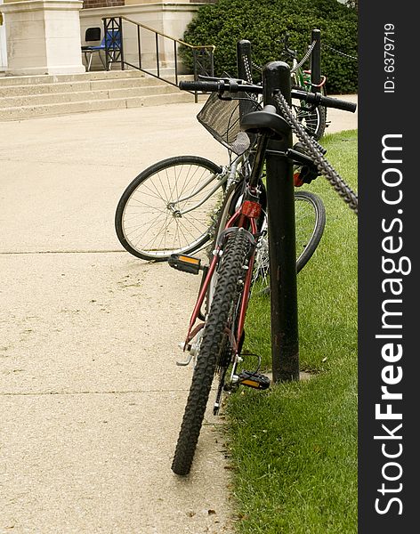 Bike locked on rack at a university campus. Bike locked on rack at a university campus.