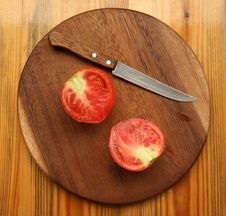 Tomato With Knife Stock Photo
