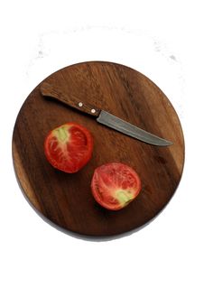 Tomato With Knife Stock Image