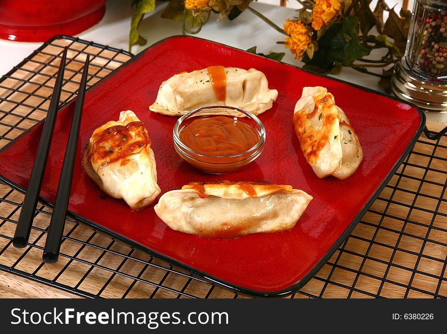 Asian dumplings and peanut dipping sauce.