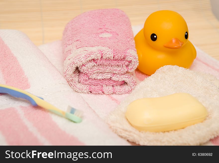 Yellow duck and pink bathtowel