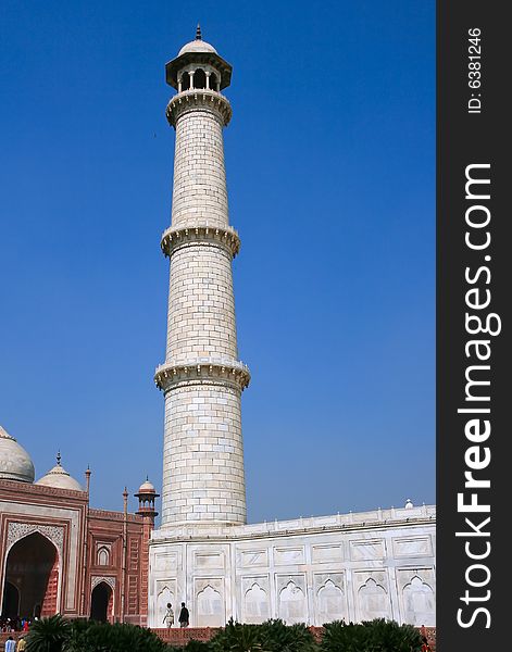 Upward point of view of one of the minarets on the corner of Taj Mahal mausoleum in Agra, India.