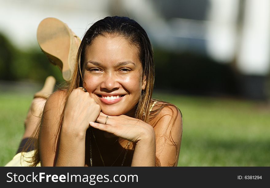 Young woman laying on grass