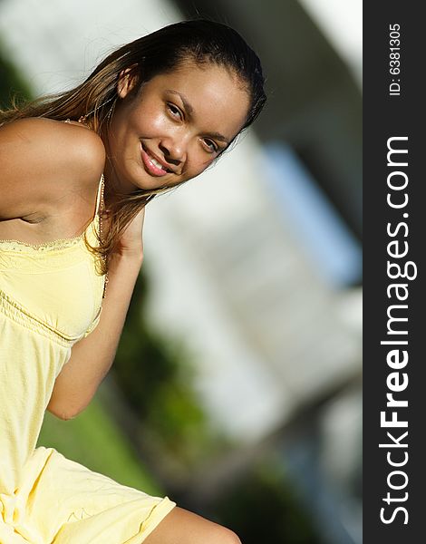 Young woman wearing a yellow dress. Young woman wearing a yellow dress