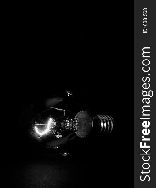 The bulb on dark background. The bulb on dark background