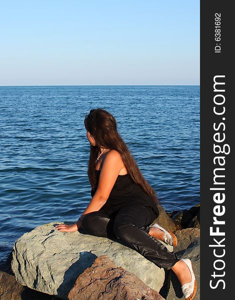 Beautiful attractive teenager model posing on sea beach. Beautiful attractive teenager model posing on sea beach