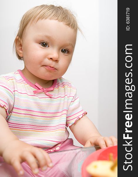 Sweet toddler  baby girl eating. Sweet toddler  baby girl eating