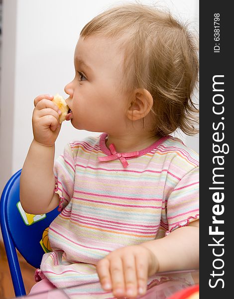 Sweet toddler baby girl eating. Sweet toddler baby girl eating