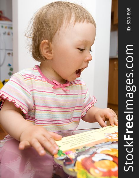 Sweet toddler baby girl reading. Sweet toddler baby girl reading